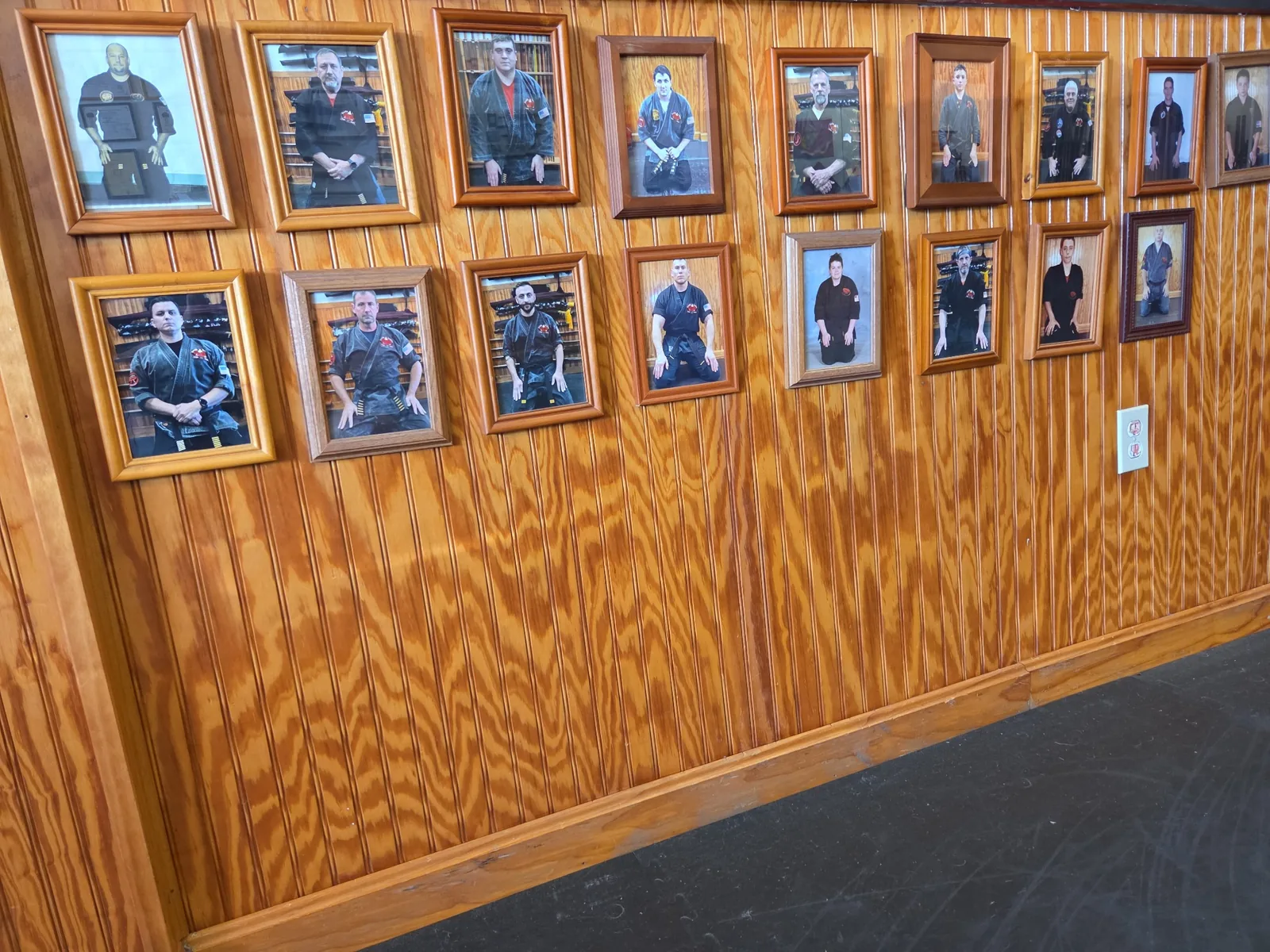 Framed photographs of Zanshin black belts